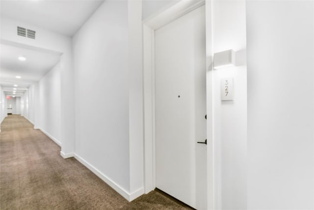 corridor featuring recessed lighting, baseboards, visible vents, and carpet flooring