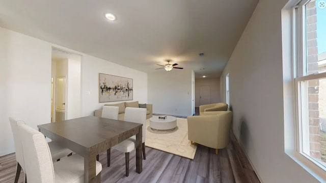 dining area with ceiling fan, baseboards, wood finished floors, and recessed lighting