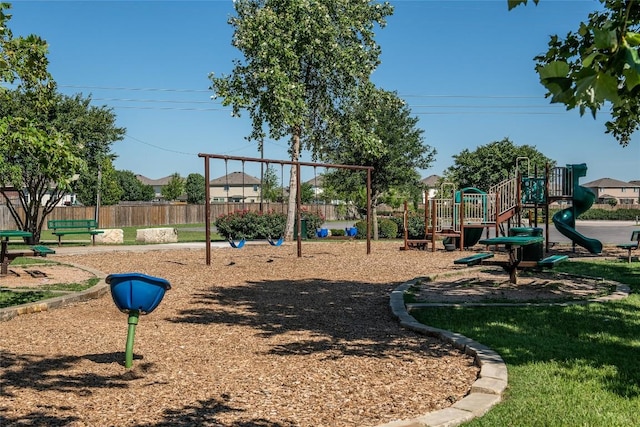 community jungle gym featuring fence