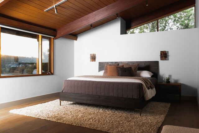 bedroom featuring track lighting, wooden ceiling, wood finished floors, and baseboards