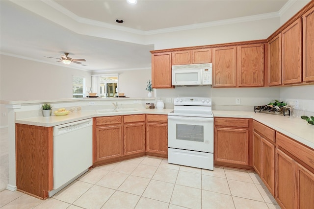 kitchen with white appliances, a peninsula, light countertops, crown molding, and a sink