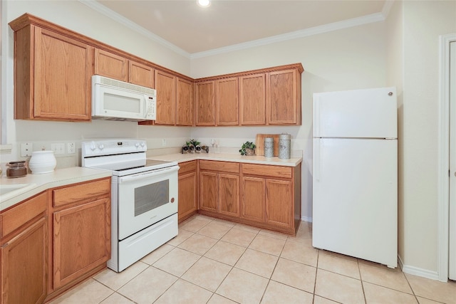 kitchen with crown molding, light countertops, and white appliances