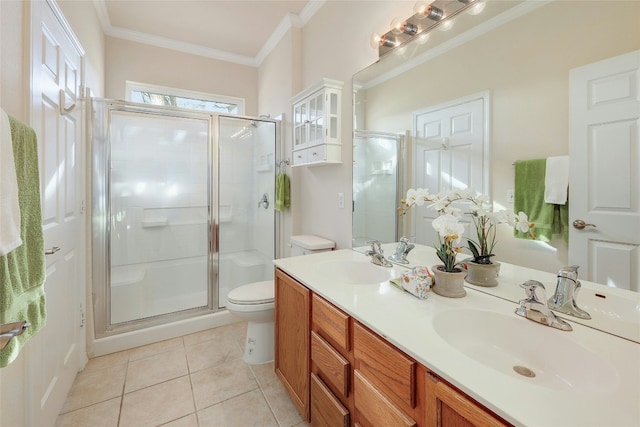 full bath featuring toilet, a stall shower, ornamental molding, and a sink