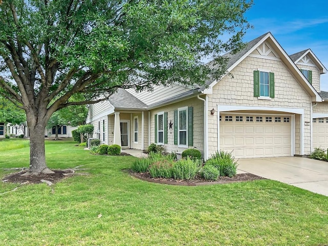 view of front of home with a shingled roof, a front lawn, driveway, and an attached garage
