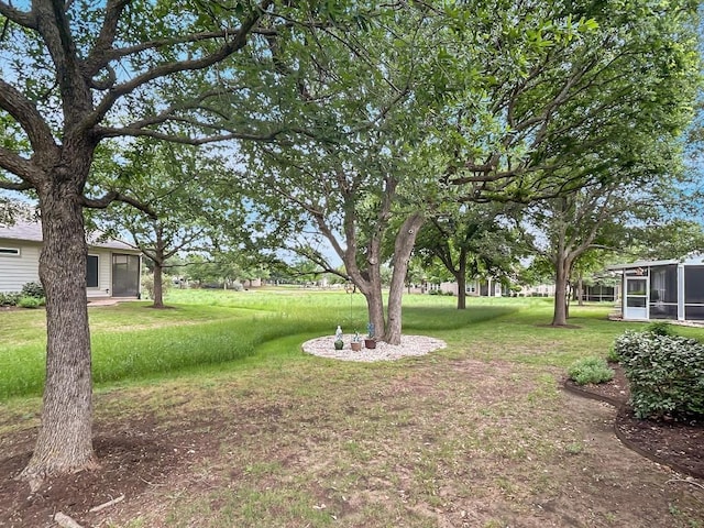 view of yard with a sunroom