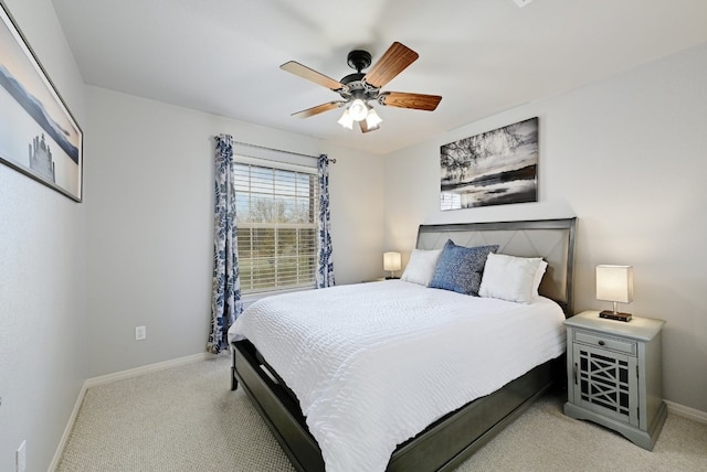 bedroom with carpet floors, baseboards, and a ceiling fan