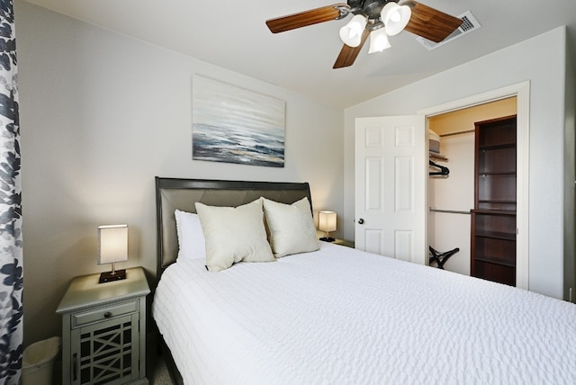 bedroom with visible vents, vaulted ceiling, and ceiling fan