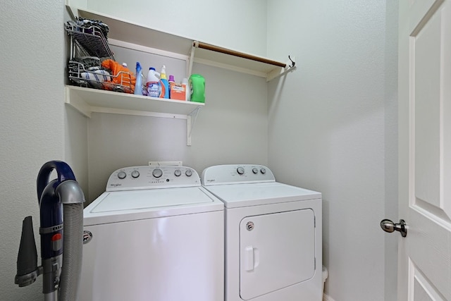 clothes washing area featuring laundry area and washing machine and dryer