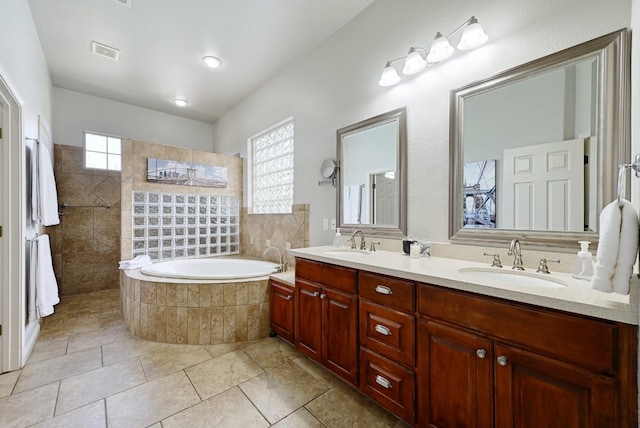 1601 Forest St, Georgetown, TX 78626 - full bathroom with double vanity, tile patterned floors, walk in shower, and a bath