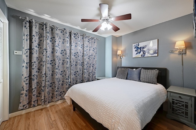 bedroom featuring ceiling fan and wood finished floors