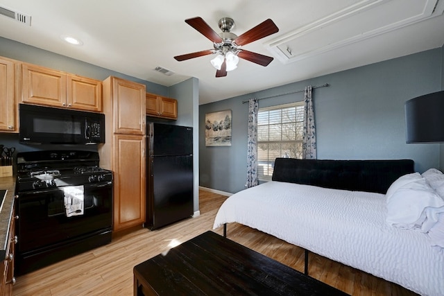 bedroom with visible vents, a ceiling fan, baseboards, light wood-style floors, and freestanding refrigerator