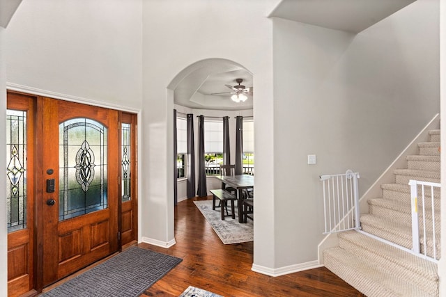 1601 Forest St, Georgetown, TX 78626 - entrance foyer featuring dark wood-style floors, a ceiling fan, arched walkways, and stairway