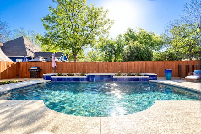 1601 Forest St, Georgetown, TX 78626 - view of swimming pool with area for grilling and a fenced backyard