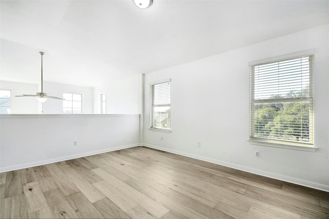 unfurnished room with baseboards, ceiling fan, and wood finished floors