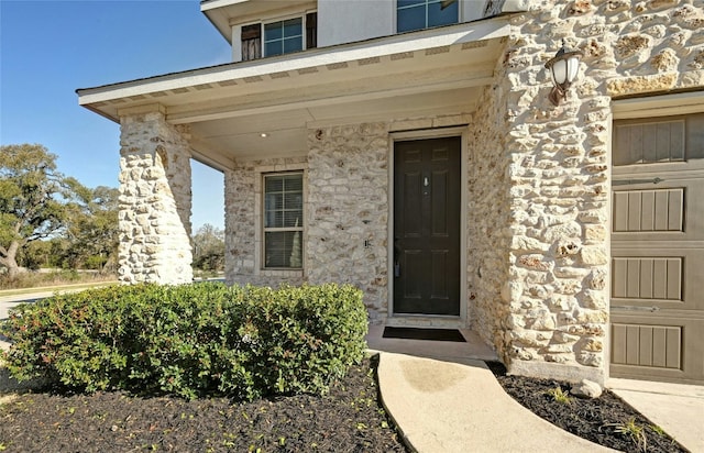 216 Iron Rail Rd, Dripping Springs, TX 78620 - view of exterior entry featuring stone siding