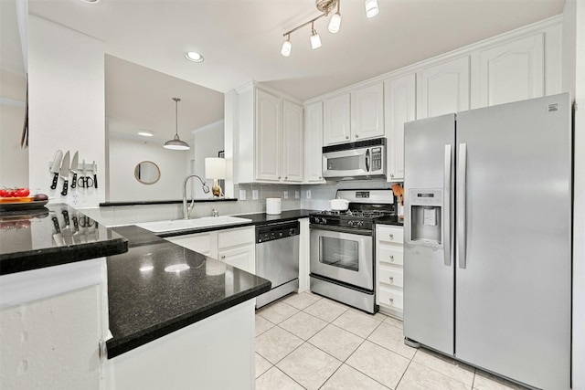 kitchen with white cabinetry, appliances with stainless steel finishes, and a sink