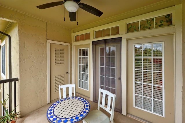 exterior space featuring a ceiling fan