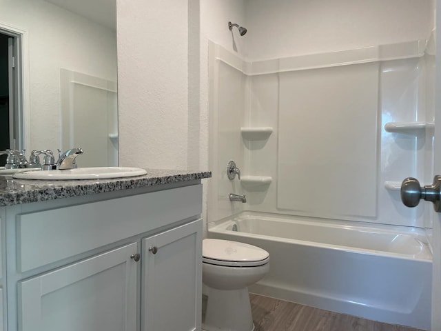 5929 Antonio Pl, Seguin, TX 78155 - bathroom with  shower combination, toilet, wood finished floors, and vanity
