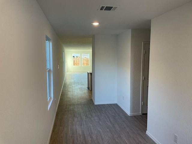 5929 Antonio Pl, Seguin, TX 78155 - hall with dark wood-style floors, visible vents, and baseboards