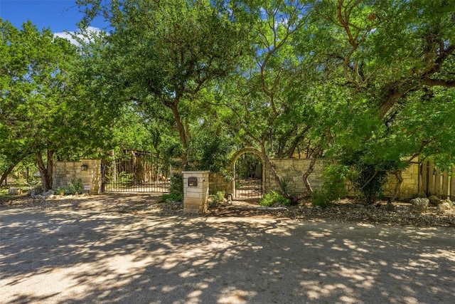 view of gate with fence