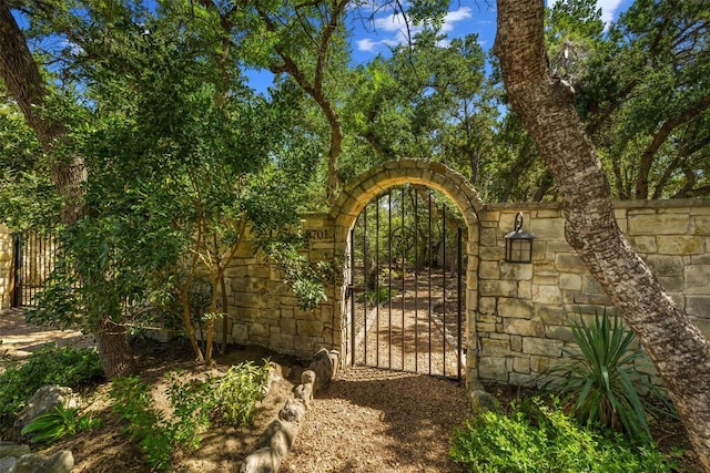 view of gate with fence