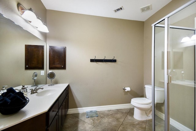 9512 Palmbrook Dr, Austin, TX 78717 - bathroom with toilet, vanity, baseboards, a shower stall, and tile patterned flooring