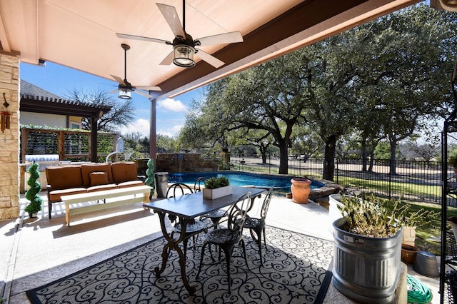 view of patio with a fenced backyard, a fenced in pool, outdoor lounge area, and a ceiling fan