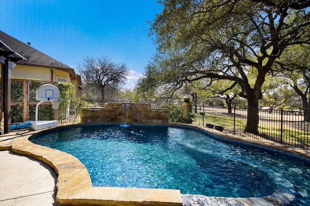 view of swimming pool with fence and a fenced in pool