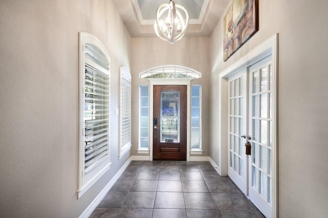 9512 Palmbrook Dr, Austin, TX 78717 - foyer with french doors, a chandelier, baseboards, and dark tile patterned floors