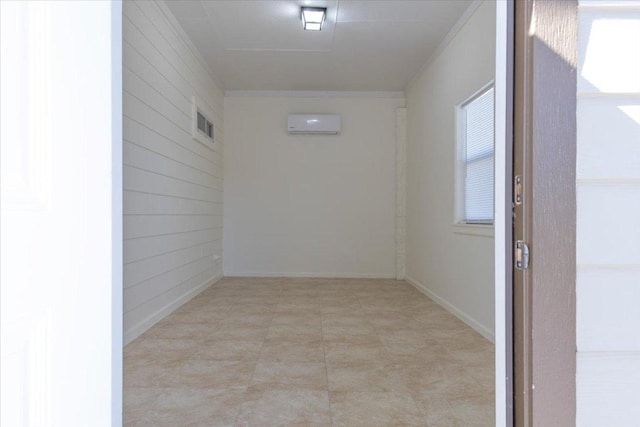 interior space with an AC wall unit and wood walls