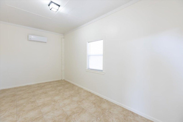 unfurnished room with crown molding, a wall mounted air conditioner, and baseboards