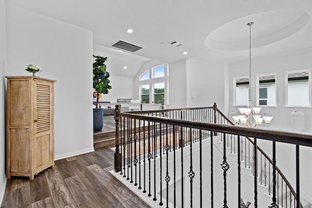 4737 Modena Bay Bnd, Leander, TX 78641 - hall with an upstairs landing, a chandelier, dark wood-style flooring, recessed lighting, and baseboards