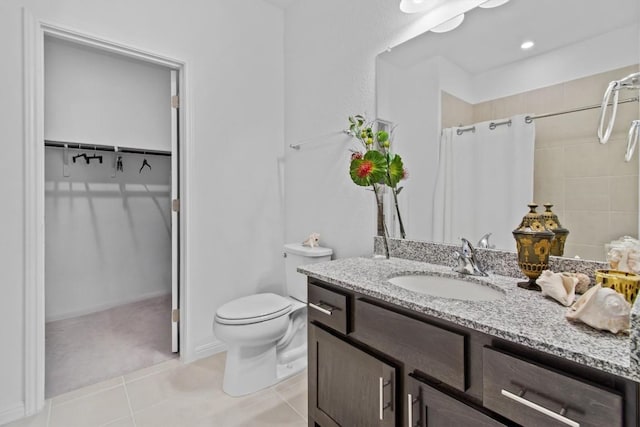4737 Modena Bay Bnd, Leander, TX 78641 - bathroom featuring toilet, tile patterned floors, vanity, a shower with curtain, and a walk in closet