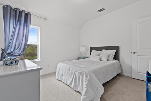 4737 Modena Bay Bnd, Leander, TX 78641 - bedroom with light colored carpet, vaulted ceiling, and baseboards