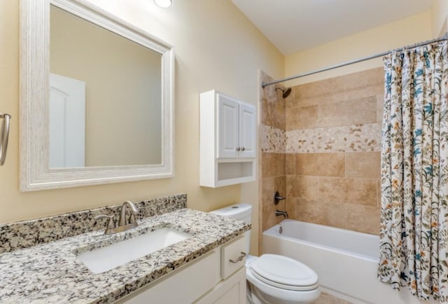 bathroom featuring toilet, shower / bath combination with curtain, and vanity