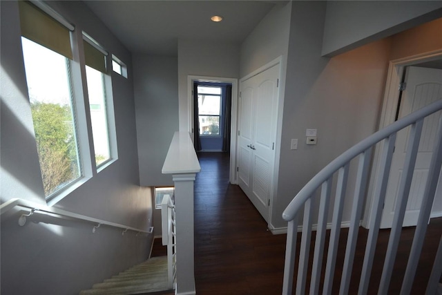 stairs with recessed lighting and wood finished floors