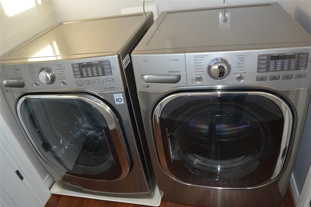 washroom featuring washer and dryer and laundry area