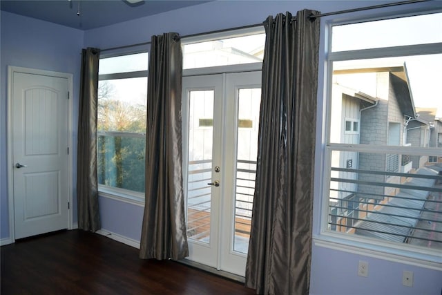 entryway featuring a healthy amount of sunlight, baseboards, dark wood finished floors, and french doors