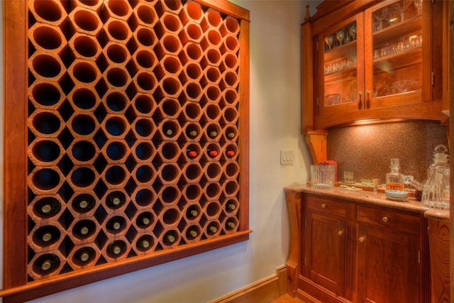 wine area featuring baseboards