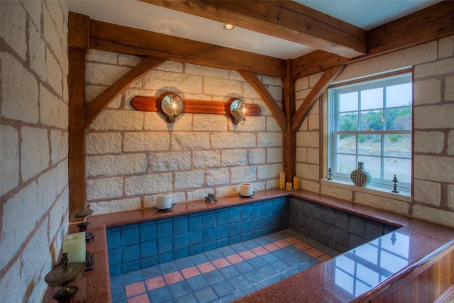 bathroom with beam ceiling