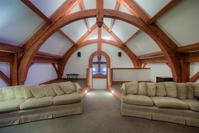 unfurnished living room with carpet flooring and lofted ceiling with beams