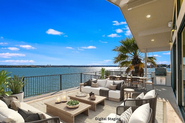 balcony featuring a water view and outdoor lounge area