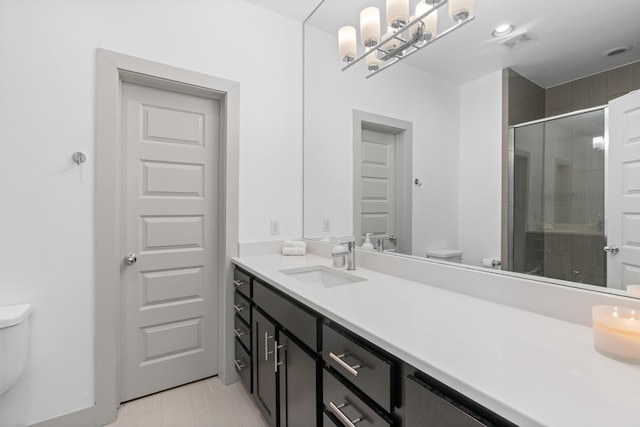 bathroom with toilet, a shower stall, visible vents, and vanity