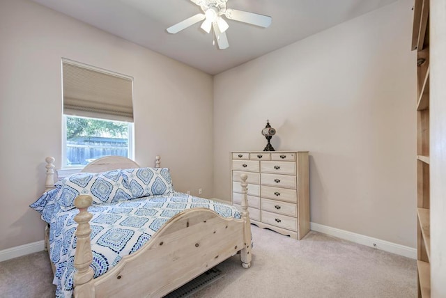 bedroom featuring carpet floors, baseboards, and a ceiling fan