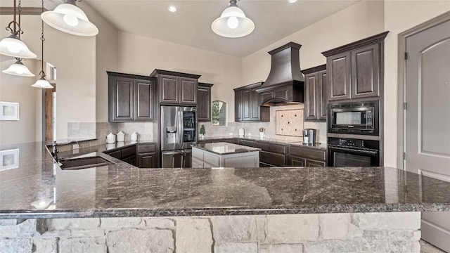 kitchen with premium range hood, a sink, backsplash, and black appliances