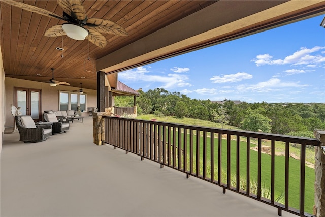 balcony with ceiling fan and outdoor lounge area