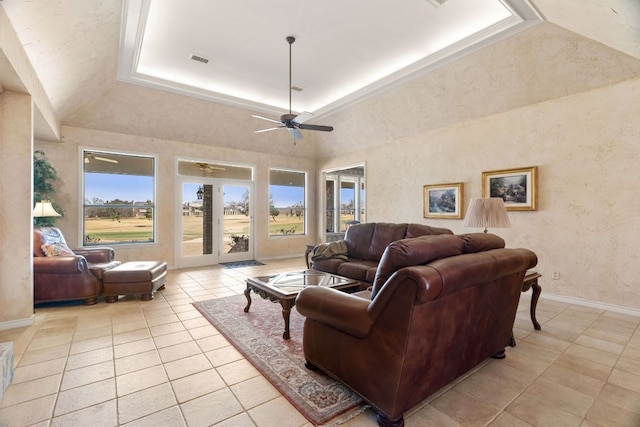 1306 Far W Rd, Horseshoe Bay, TX 78657 - living room with light tile patterned floors, ceiling fan, a raised ceiling, and lofted ceiling