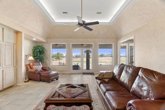 1306 Far W Rd, Horseshoe Bay, TX 78657 - living room featuring ceiling fan, light tile patterned flooring, ornamental molding, and a textured wall