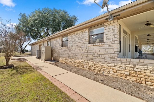 1306 Far W Rd, Horseshoe Bay, TX 78657 - view of property exterior with a ceiling fan and stone siding