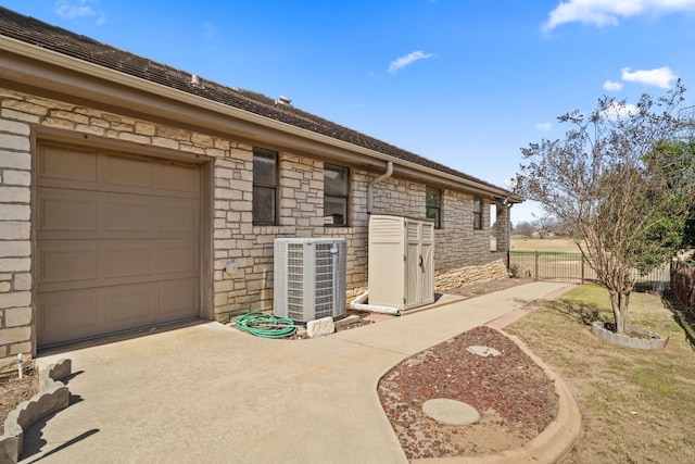 1306 Far W Rd, Horseshoe Bay, TX 78657 - view of side of property with stone siding and driveway